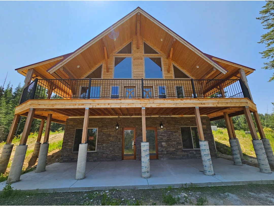 Finished log home with an amazing wraparound deck