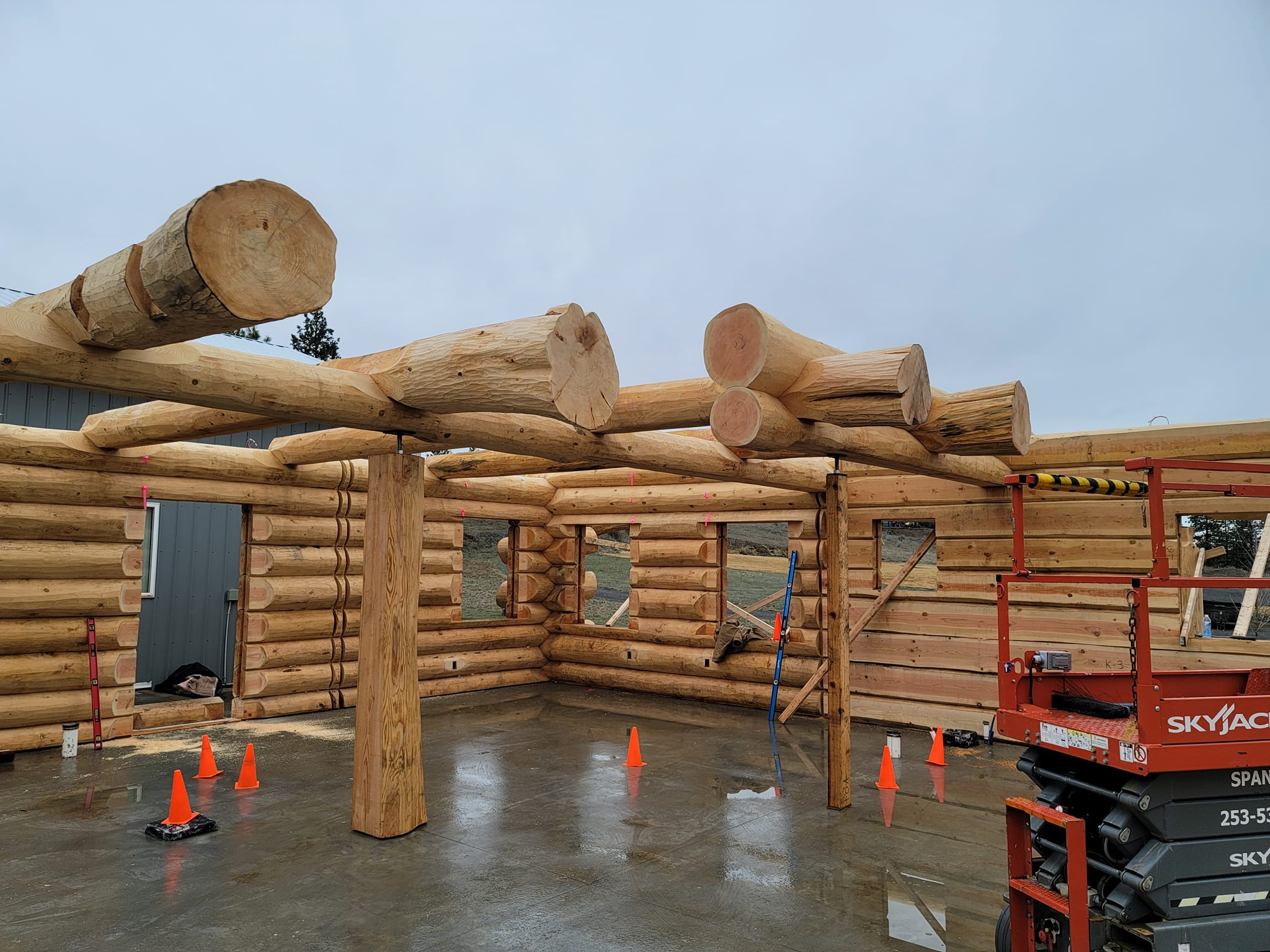 Log home construction framing begins