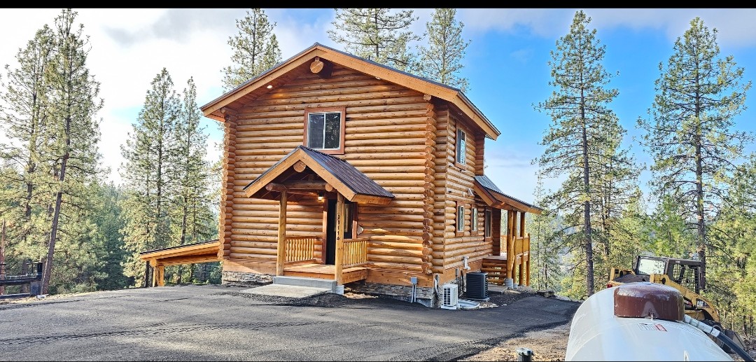 Welcome home — completed log home exterior